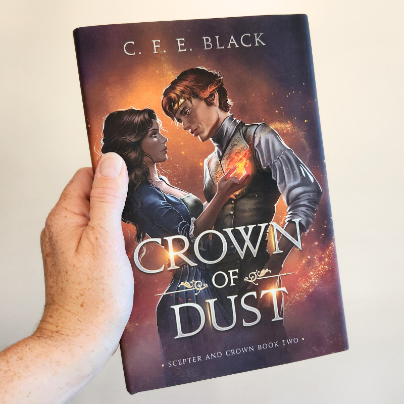 Crown of Dust hardback book in hand