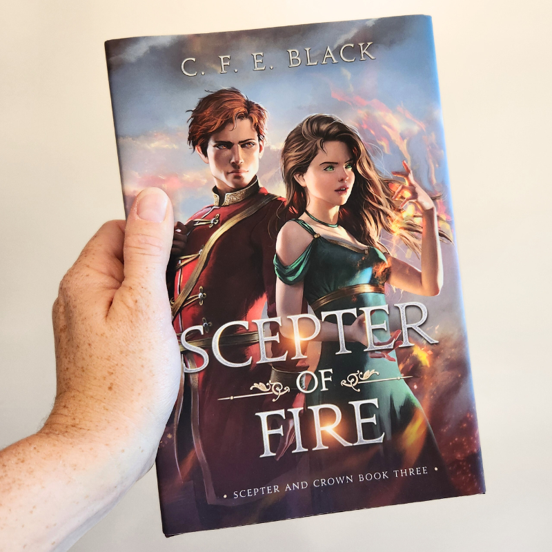 Scepter of Fire YA fantasy hardback in hand