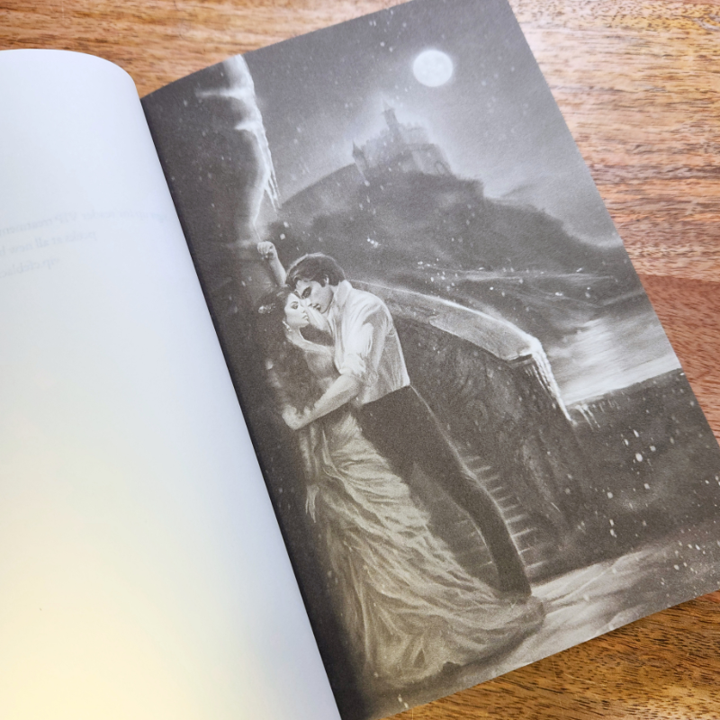 Open book featuring an Illustration of a couple embracing under a moonlit sky.