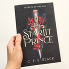 The Starlit Prince fantasy romance hardback in hand